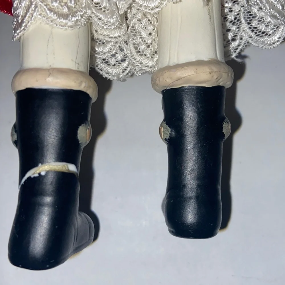 Vintage African American doll ornament with red velvet and leopard fur purse